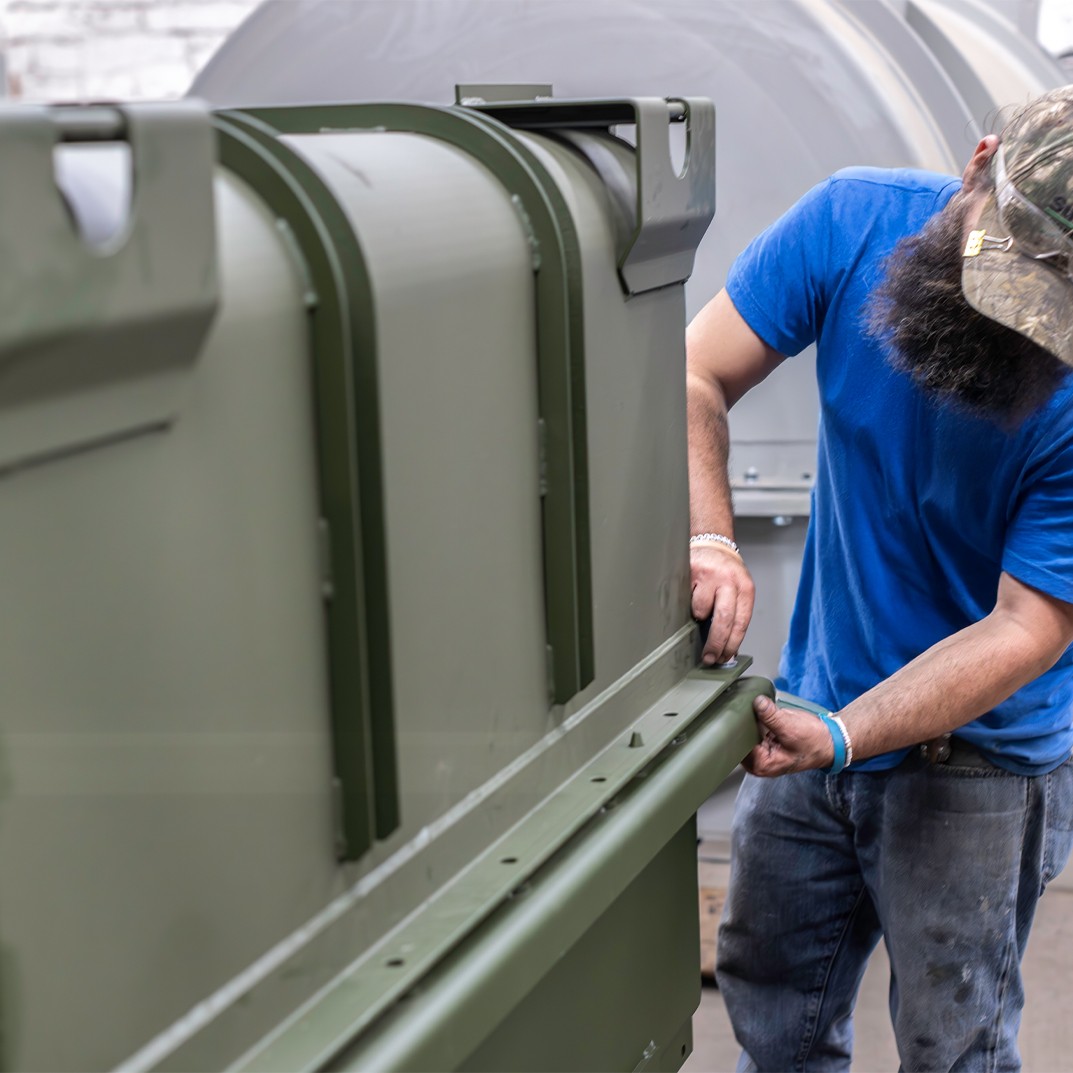 Men working on a container at The Champion GSE - June 2025