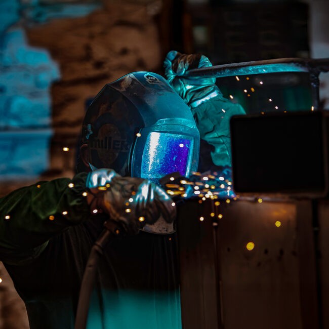 Welder working on metal at The Champion GSE