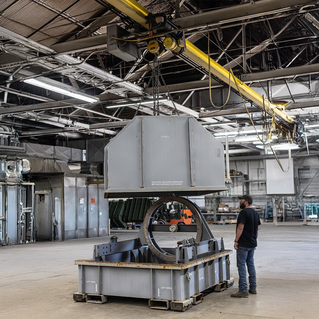 Worker looking at a LM2500 container in the warehouse