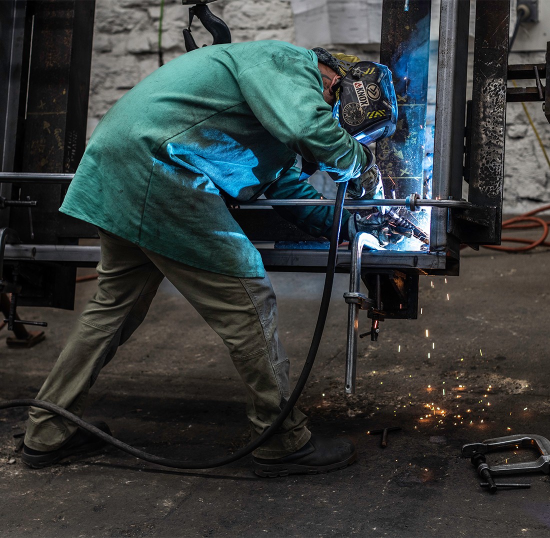 Worker welding a piece of metal at The Champion GSE - June 2025