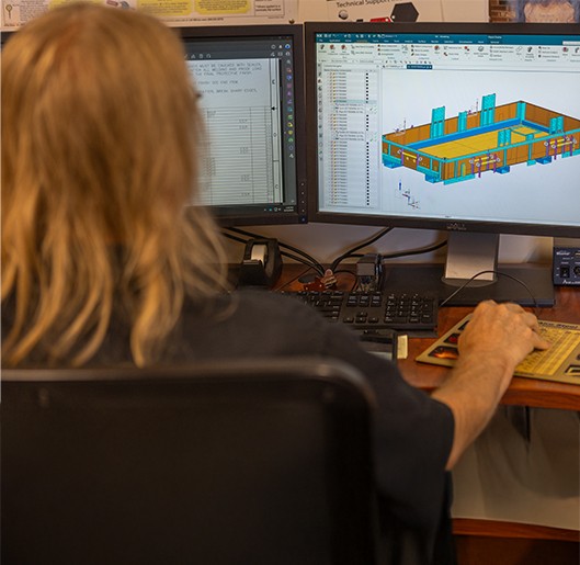 Engineer at the Champion GSE office looking at his screens