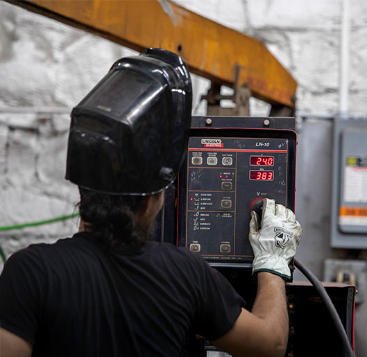 Champion GSE employee working with machinery