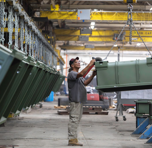 man checking quality of some containers